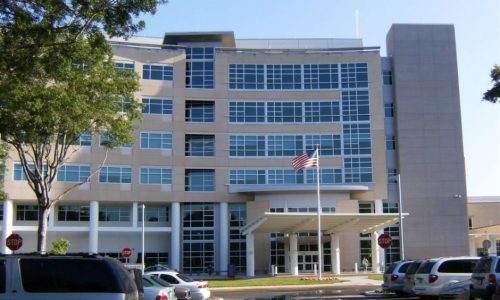 Parrish Medical Center entrance with flag pole